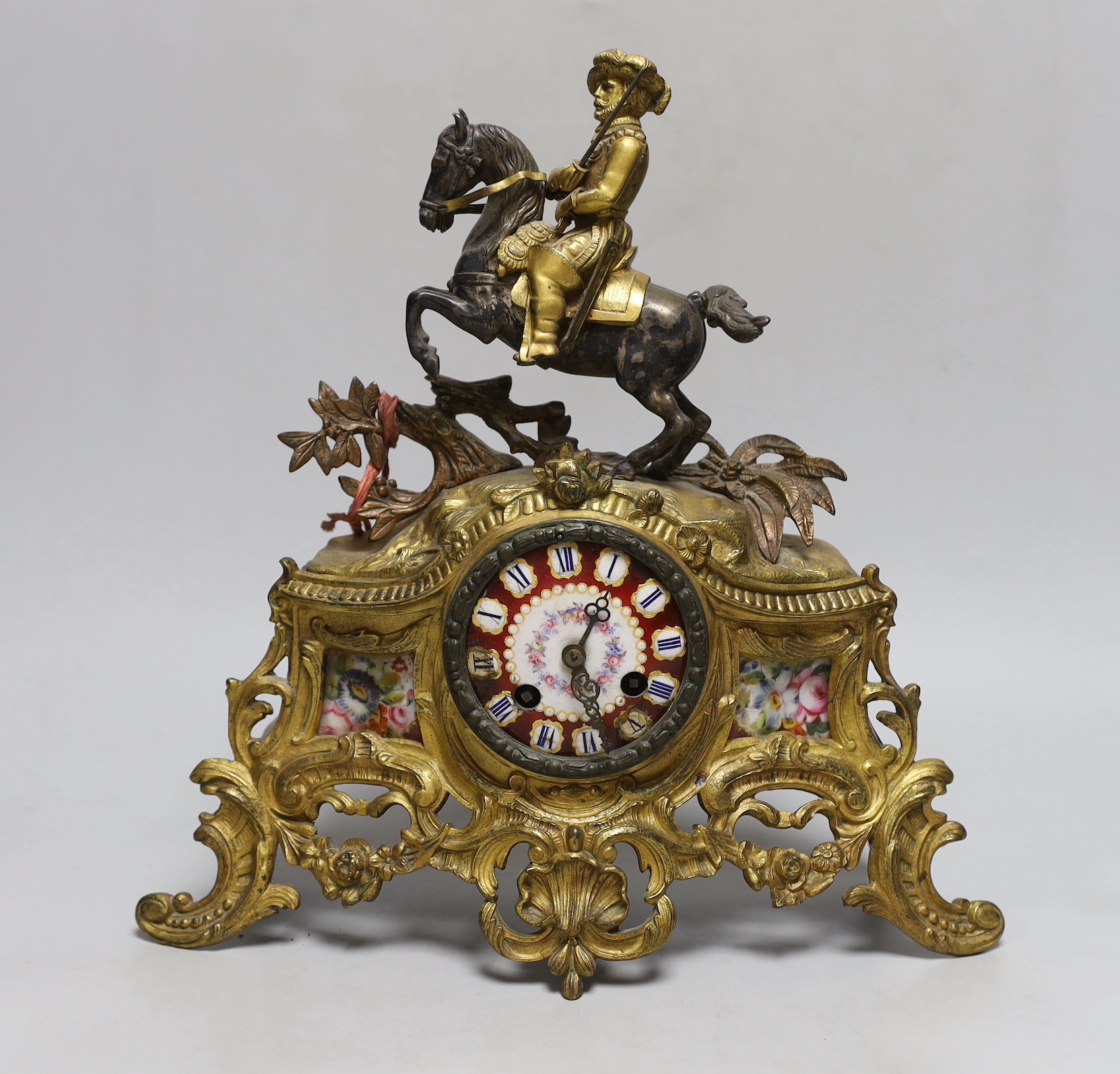 A 19th century French gilt metal ‘cavalier’ mantel clock, 33cm tall